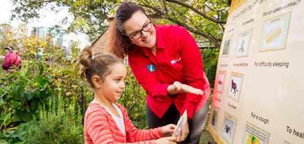 Young girl participating in a school visit of Cooks Cottage.